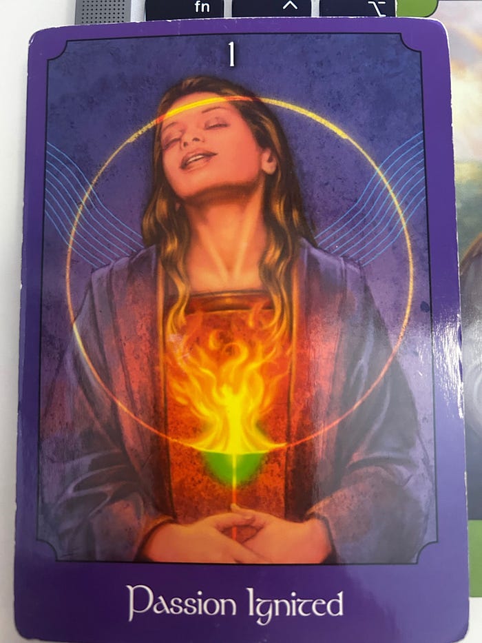 Tarot card showing a woman with glowing fire at her heart, symbolizing passion ignited, spiritual awakening, and renewed soul purpose.