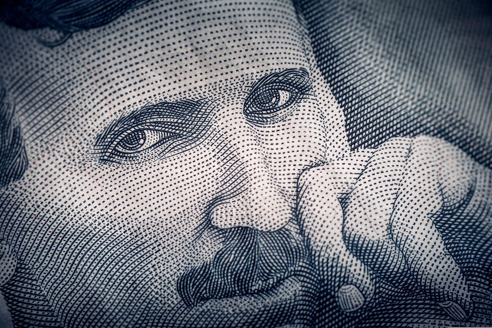 Black-and-white portrait of inventor Nikola Tesla, whose groundbreaking work in electricity and wireless technology helped shape the modern world.