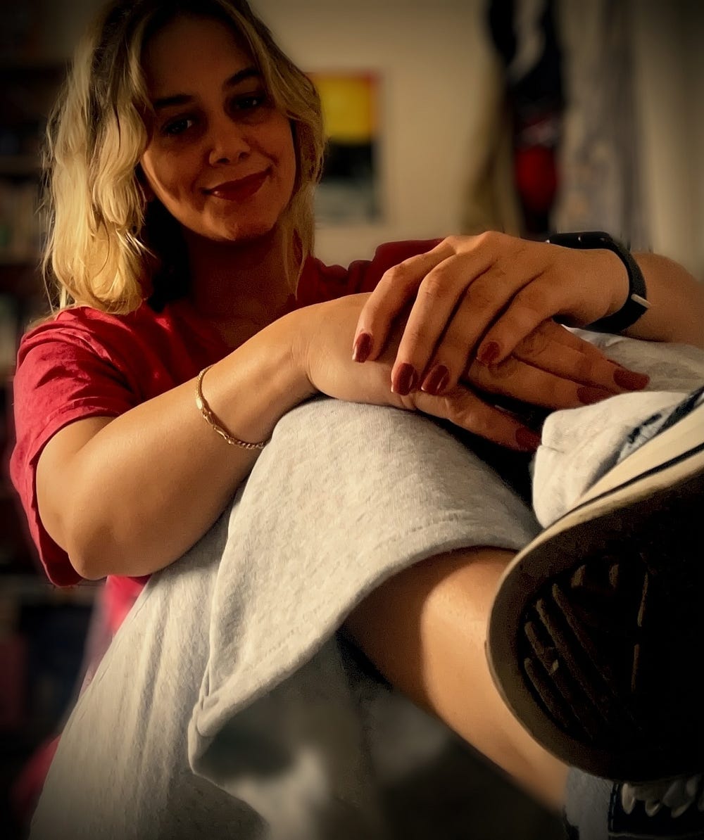 Michelle Morera Milocamilo sitting comfortably with a relaxed smile, representing calm confidence and the concept that your energy speaks before words.